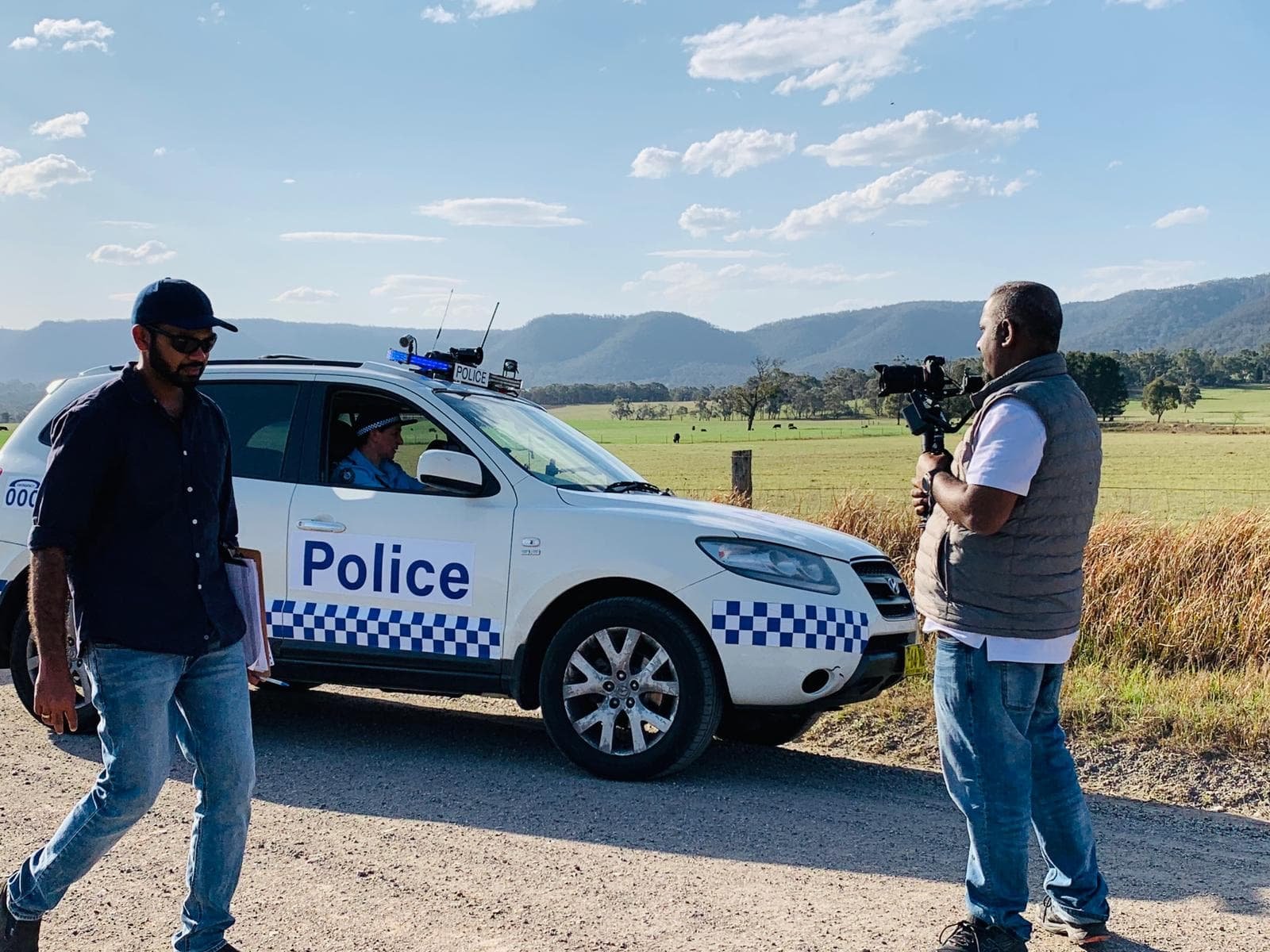 Outdoor production with police vehicle