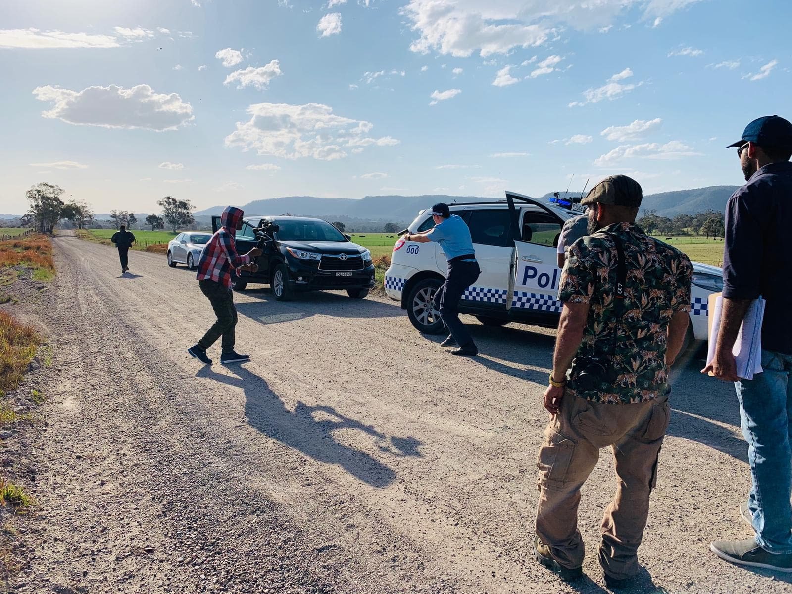 Film crew shooting on a rural road